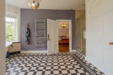 Timeless finishes complement the character of the principal suite