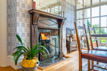 Oak flooring and an original fireplace enrich the space