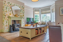 The living room offers a warm and welcoming family retreat